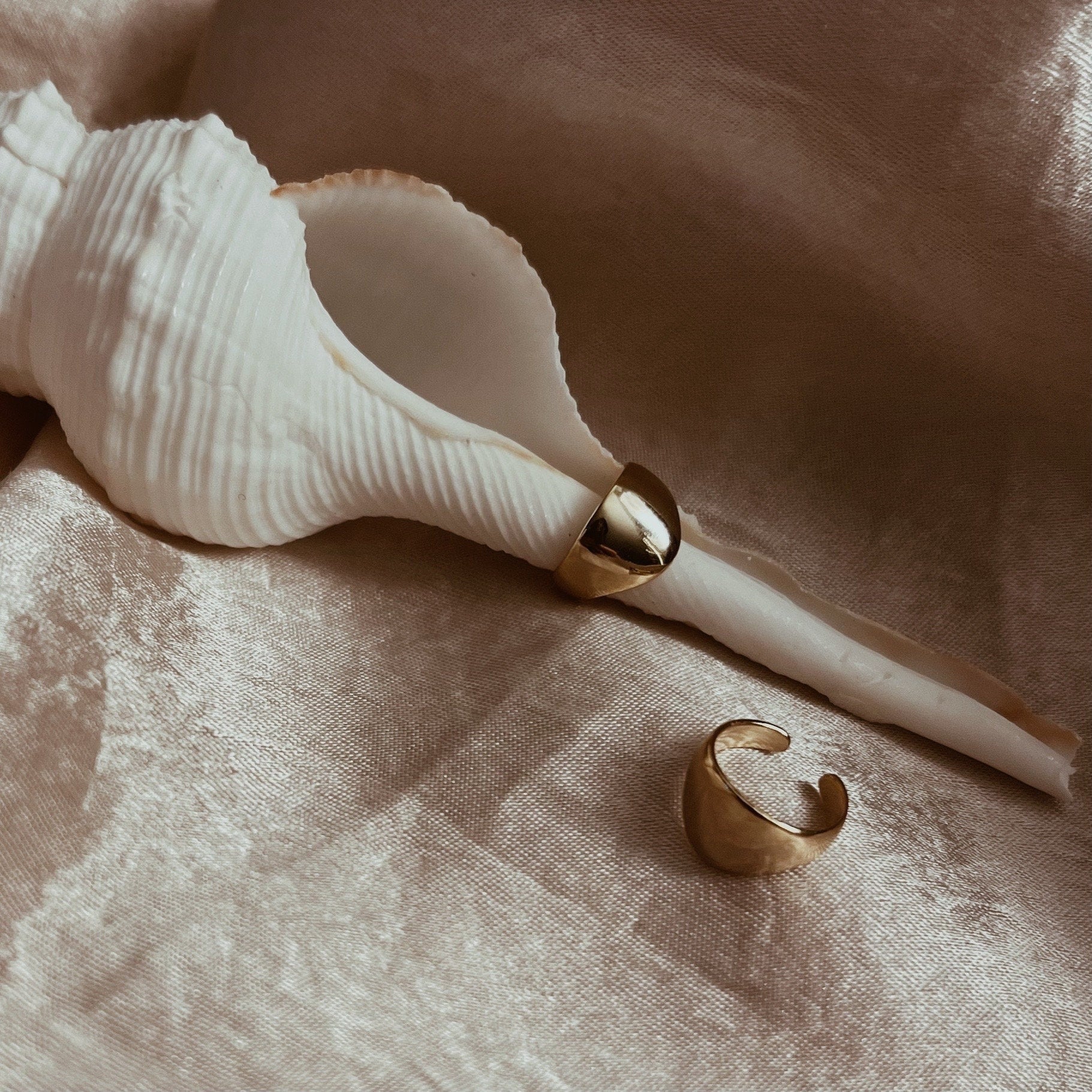 Gold and silver ear cuff in minimalist style