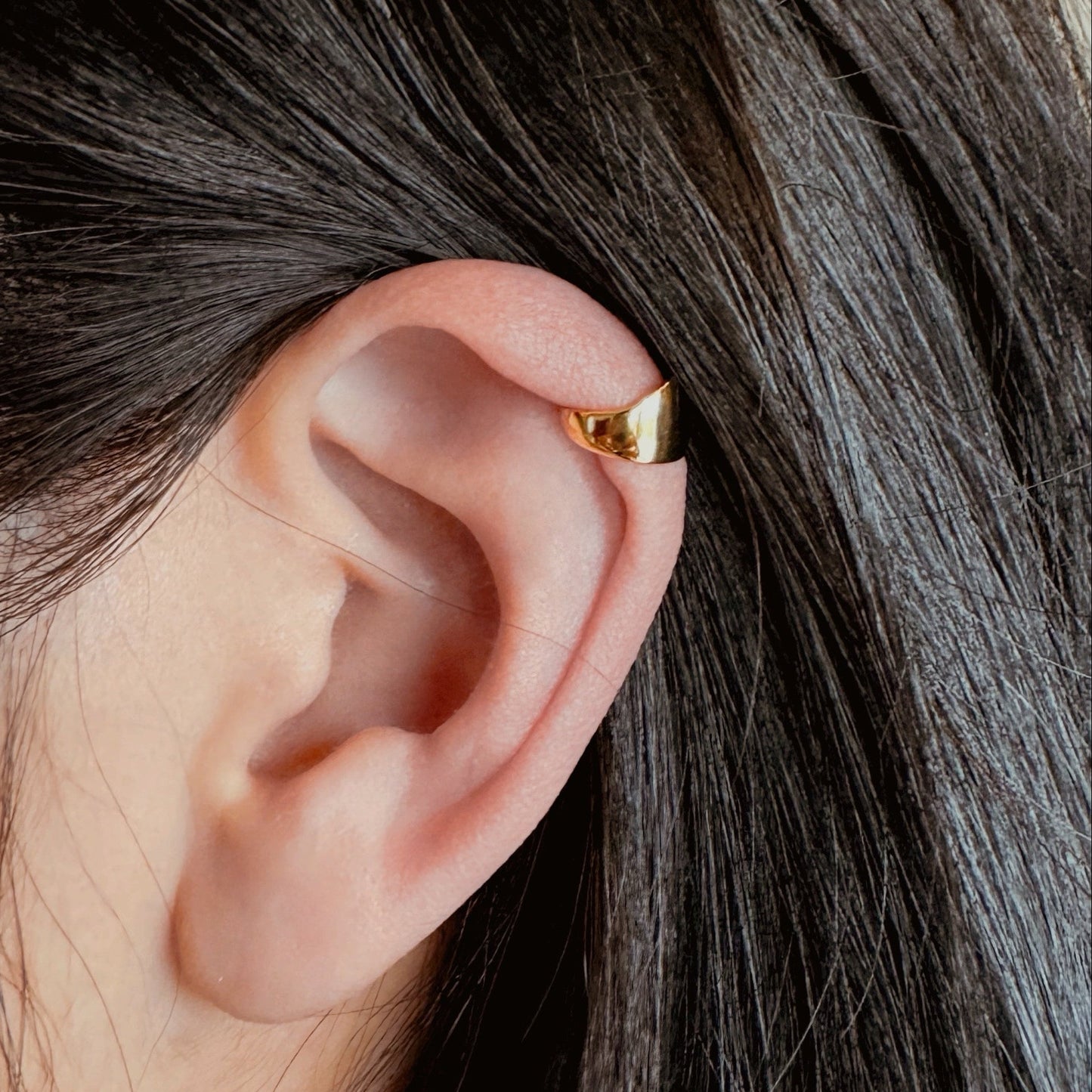 Gold and silver ear cuff in minimalist style