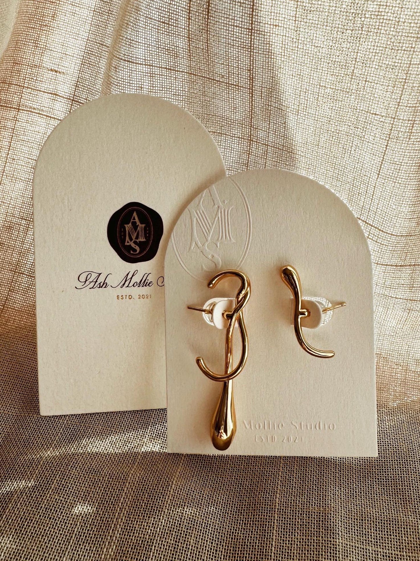 Gold-plated sterling silver drop earrings with uneven design