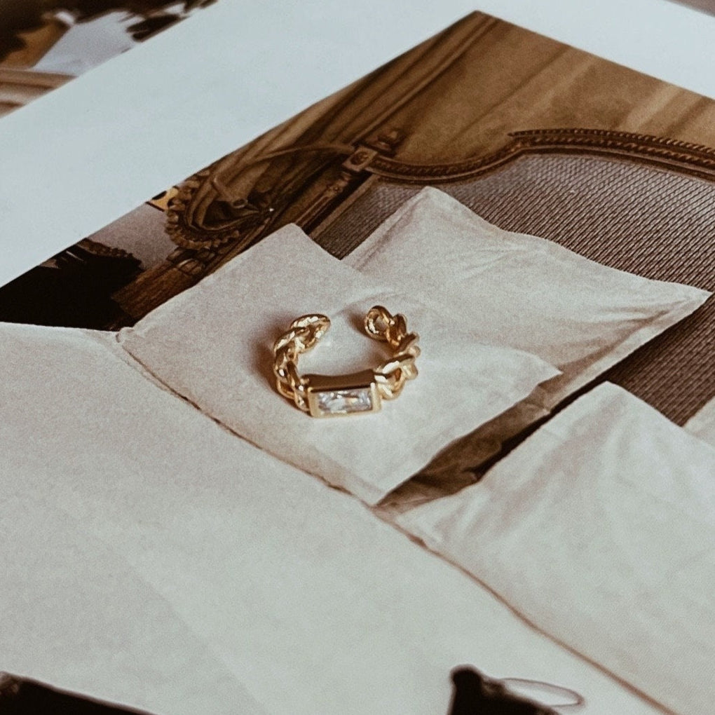 Gold and silver crystal ear cuff with a chain design