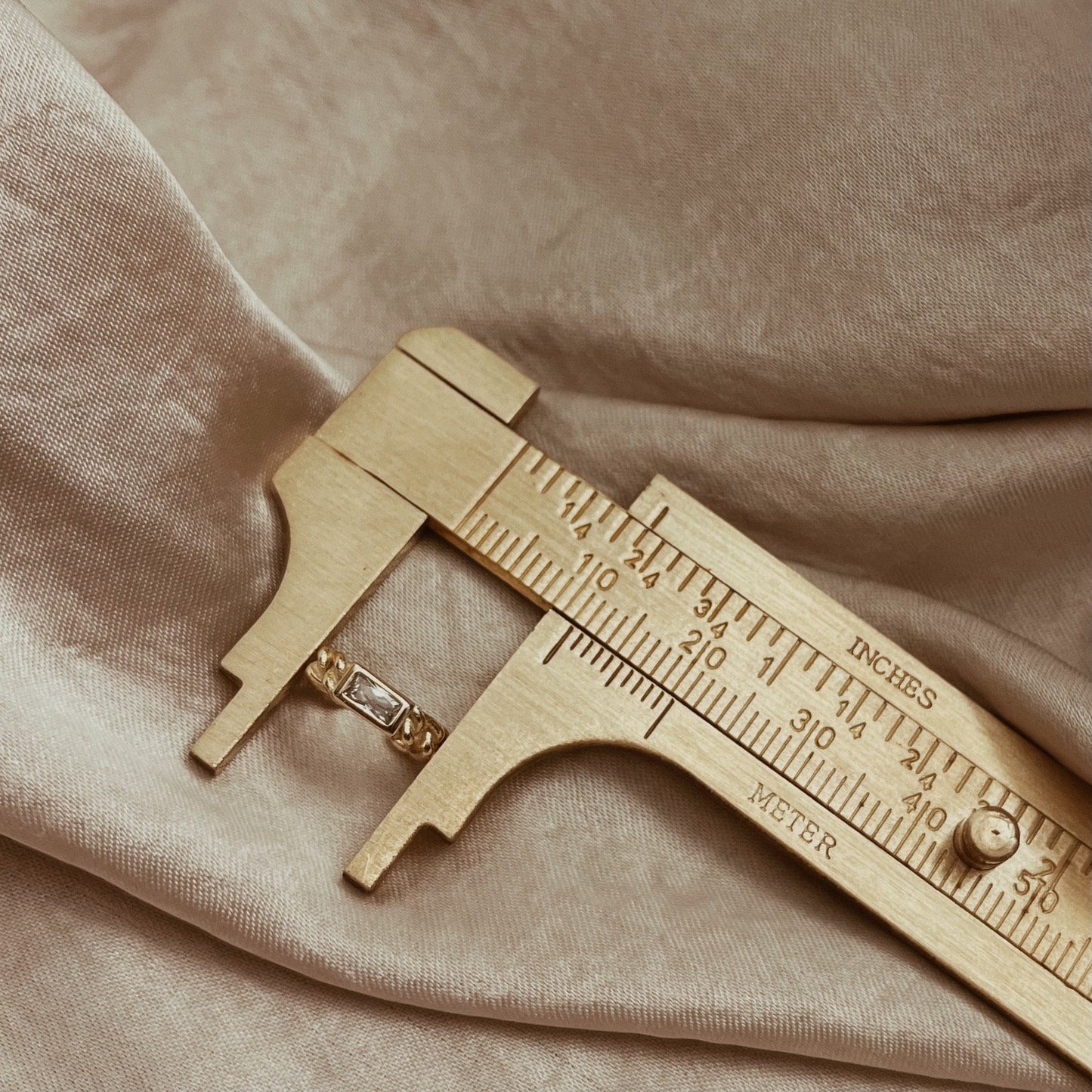 Gold and silver crystal ear cuff with a chain design