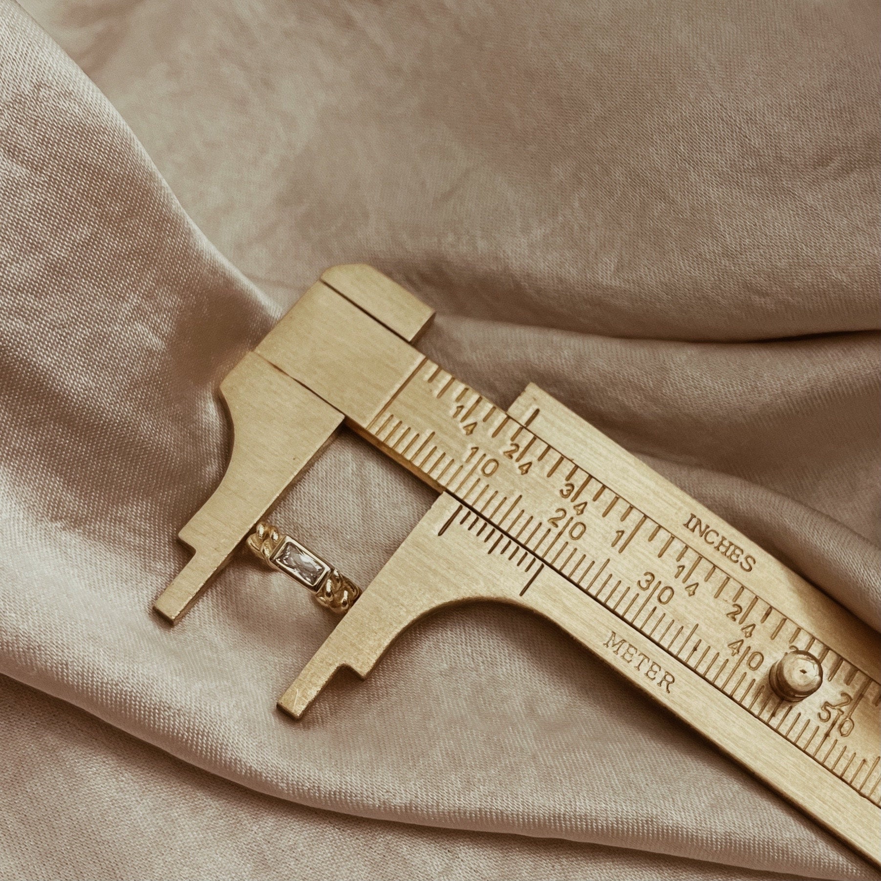 Gold and silver crystal ear cuff with a chain design