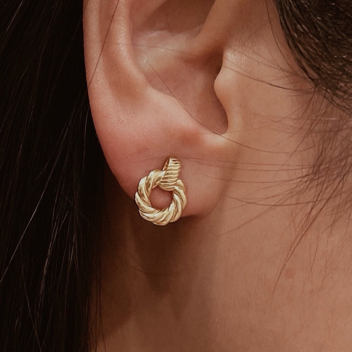 Gold plated small hoop earrings with braided rope design