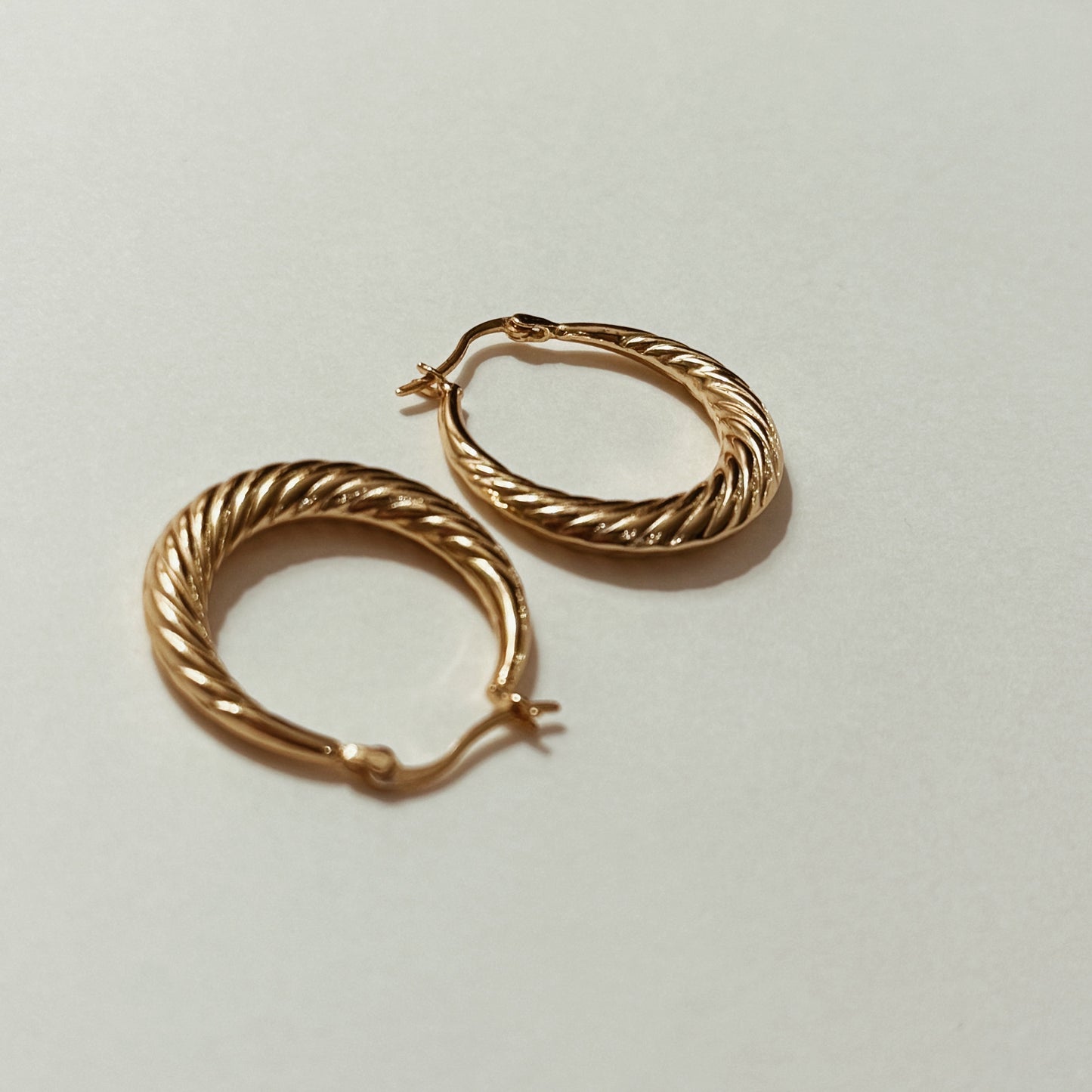 Small gold-plated vintage hoop earrings with spiral texture